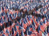 sea of us flags cross shadow he is with us