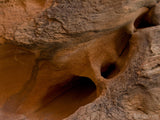 pattern holes in the sandstone walls