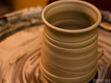 jar of clay on a potters wheel