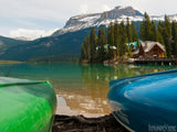two canoes frame the still mountain lake