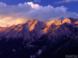 sunset on the peaks of mountain ridge