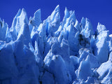 peaks of snow and ice in blue sky