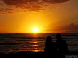 a couple enjoys the perfect sunset