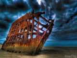dark stormy skies over the Peter Iredale shipwreck 