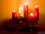 red advent candles in background