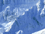 close up of rugged ridge of snow white mountain