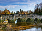 stone bridge over still waters