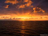 twilight sunburst background at sunset orange god rays