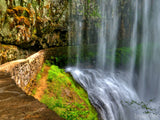 veil of water pathway behind waterfall