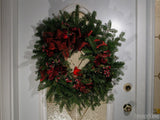 christmas background welcome wreath on white door